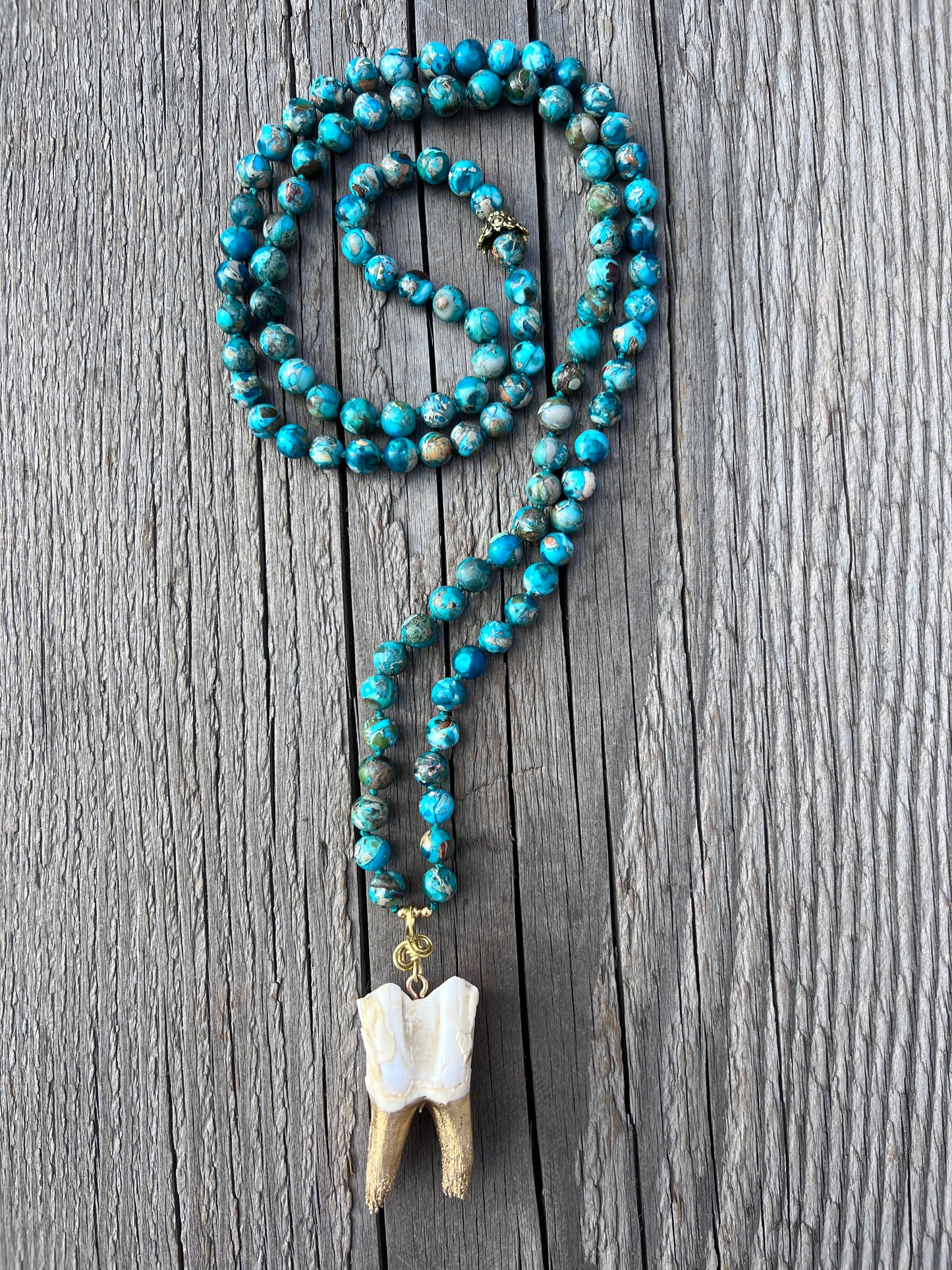 A-s-k and receive. Elk tooth pendant, brass wire, gold plated beads, jasper round beads, mala & bracelet. Elk tooth harvested from the forest after animal naturally died. Gratitude to the Earth for this exceptional life.