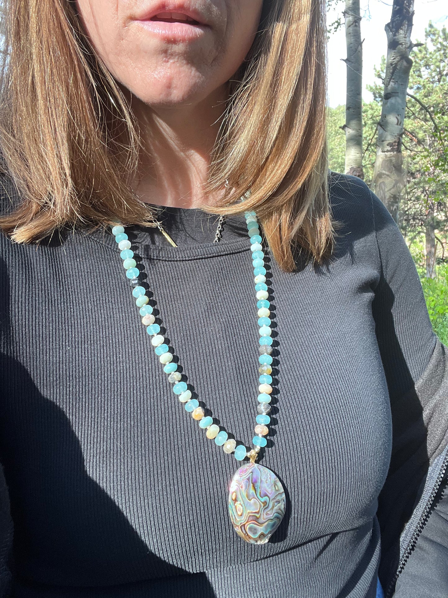 Amazonite and quartz pendant mala. Brass beads and wire. Moving towards liberation and light.