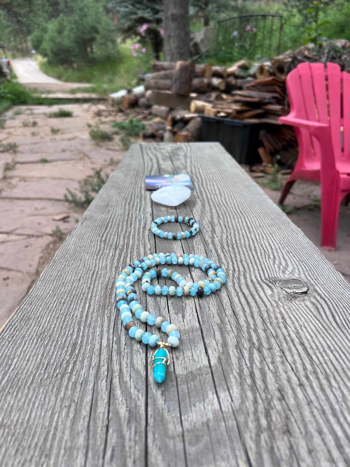 Amazonite and quartz pendant mala. Brass beads and wire. Moving towards liberation and light.