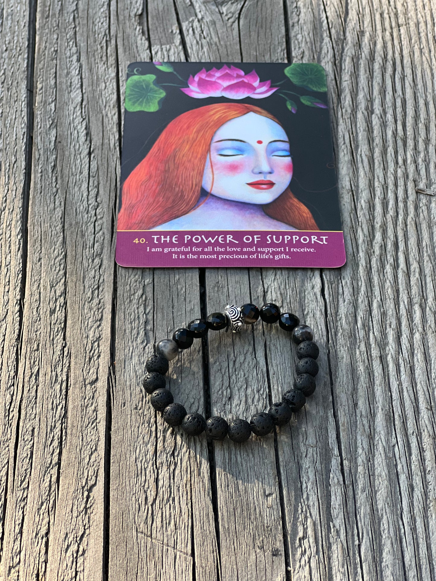 Shadow support, walking through thickness and challenge with light. Lava bracelet with agate & sterling silver bead.
