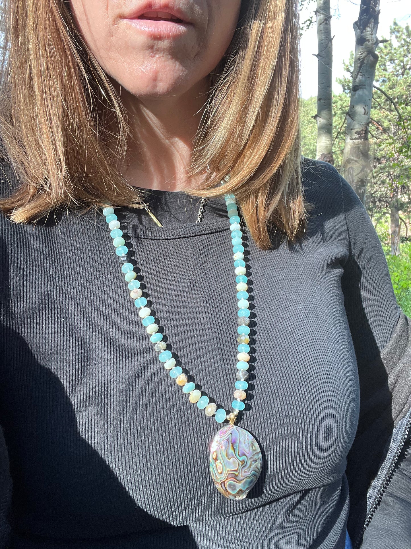 Amazonite and quartz pendant mala. Brass beads and wire. Moving towards liberation and light.￼