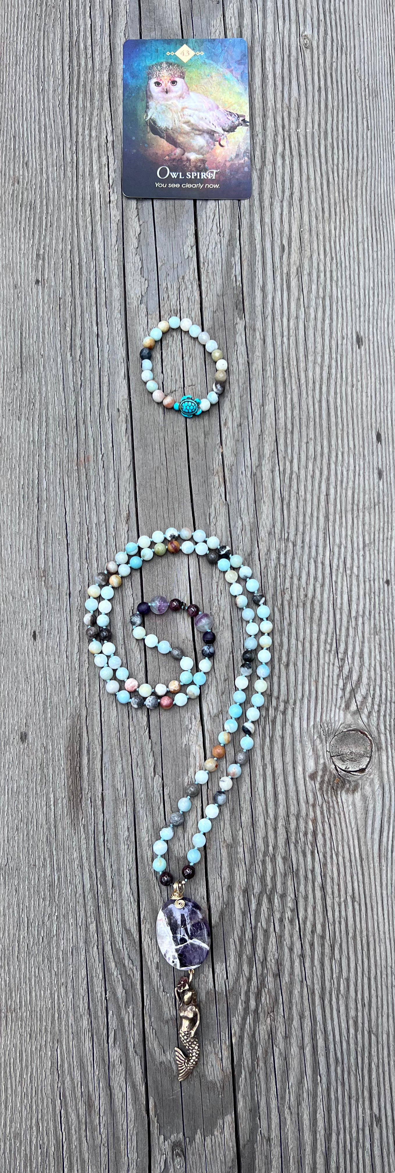 Mermaid spirit ~ 8 ~ infinity. Amazonite round beads with amethyst and garnet. Amethyst & brass mermaid pendant. Brass beads.