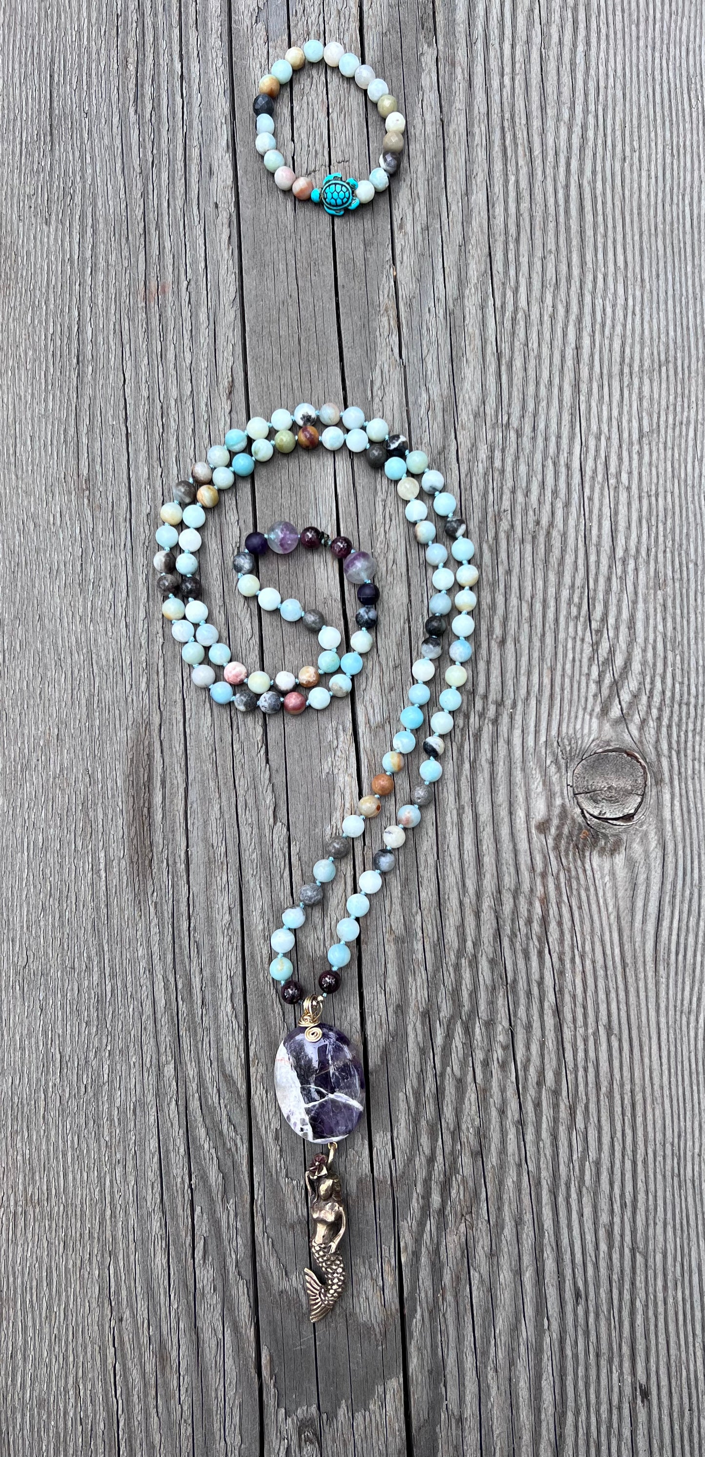 Mermaid spirit ~ 8 ~ infinity. Amazonite round beads with amethyst and garnet. Amethyst & brass mermaid pendant. Brass beads.